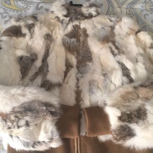 Wilson’s Leather Maxima Fur Coat. Sleeves are 23 inches. Coat is 22 inches.